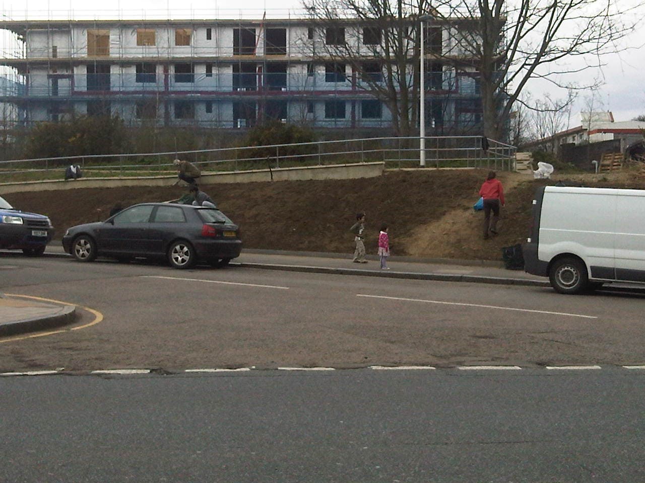 Volunteers digging the soil at Brockley Common beside the railway